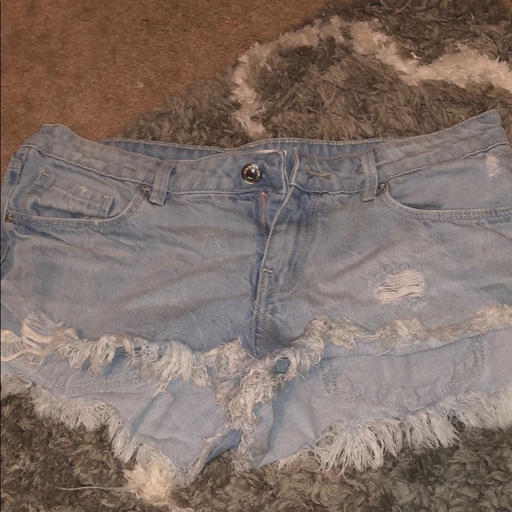 Light blue frayed shorts